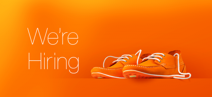 We're Hiring with orange branded shoes.